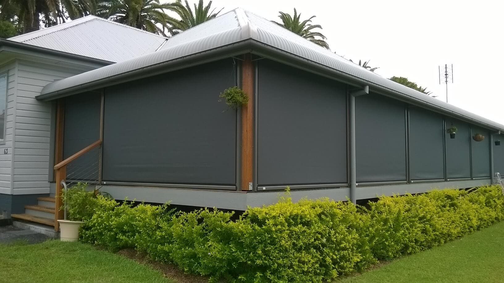 Outdoor blinds wrapping a verandah