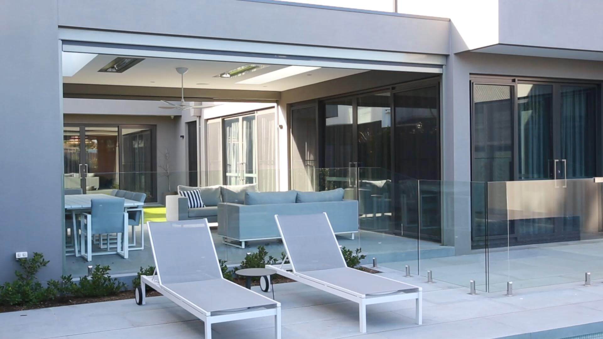 Zipscreen blinds across a poolside alfresco