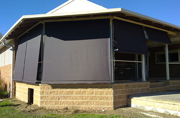 Window awnings on a brick home